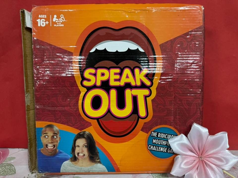 Speak Out Mouthpiece Challenge Game (Category: Board Games & Puzzles) located in Caloocan City. Submitted by brightgamesph (Listing ID 1430252225, Image 1). Description: Get ready for hilarious fun with the Speak Out game! This game is designed for ages 16+ and 2+ players. The box features a vibrant design with the game's name prominently displayed. It promises a ridiculous mouthpiece challenge game. Perfect for game nights and gatherings with fr