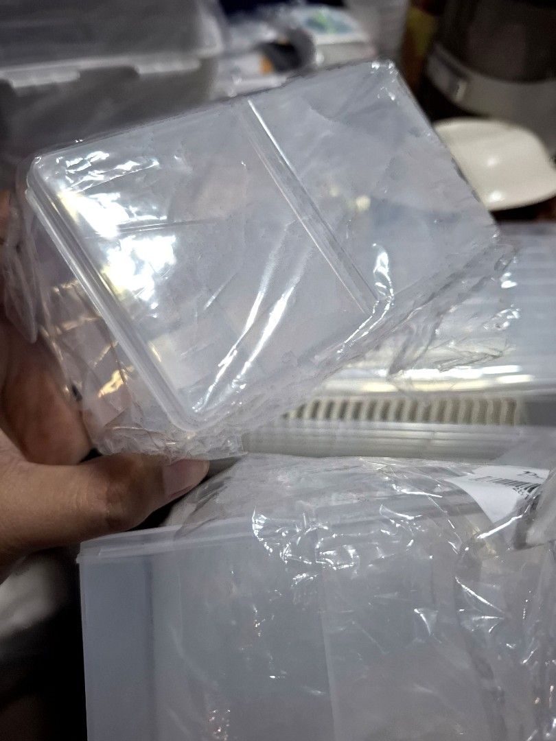 Storage Box 2 grids - sold each (Category: Storage Boxes & Baskets) located in Quezon City. Submitted by an.marie (Listing ID 1430218638, Image 2). Description: Clear plastic storage box features two compartments, ideal for organizing small items. The box is transparent, allowing easy visibility of the contents. It's suitable for storing various items, from craft supplies to small accessories. The compact size makes it perfect for use at home or 
