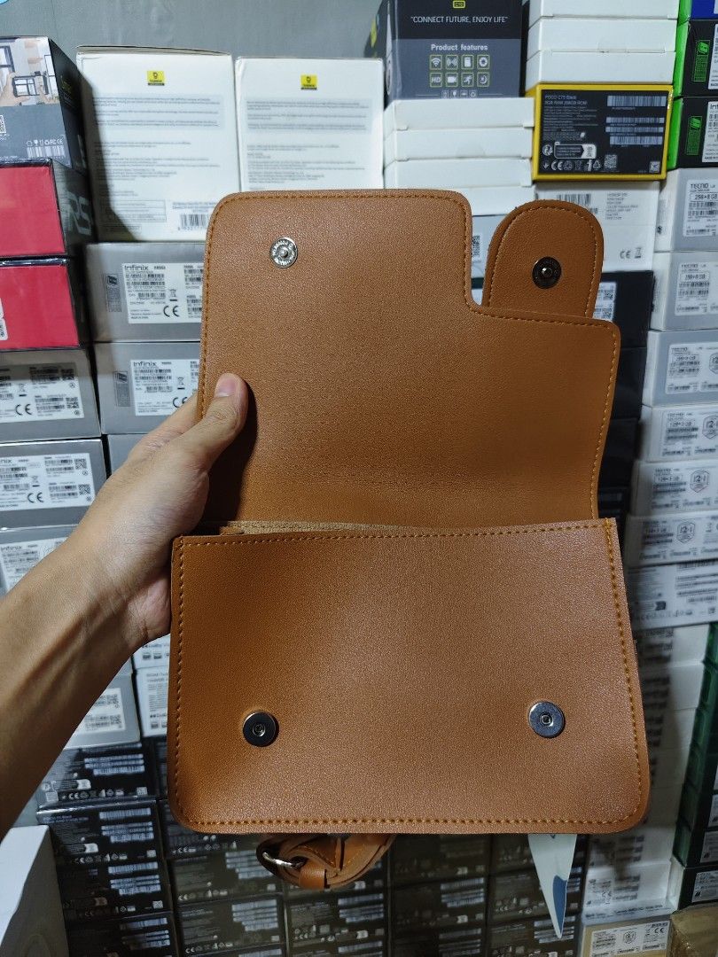 Straightforward Boundless Basics Bag (Category: Luxury Bags & Wallets) located in Marilao. Submitted by declutterwjosh13 (Listing ID 1430352036, Image 3). Description: Brown bag from Straightforward. It has a flap closure with a magnetic snap. The bag has a main compartment and a small pocket inside. The brand tag is still attached..