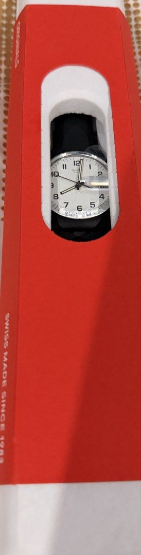 Swatch Gent Black strap Watch GB743 (Category: Men's Watches) located in Paranaque City. Submitted by homebox.com (Listing ID 1430332772, Image 3). Description: Swatch Gent watch features a black strap and a white dial with black numerals. It has a day and date display. The watch comes with its original box. The model number is GB743-S26. It is a Swiss-made watch. Guaranteed original .