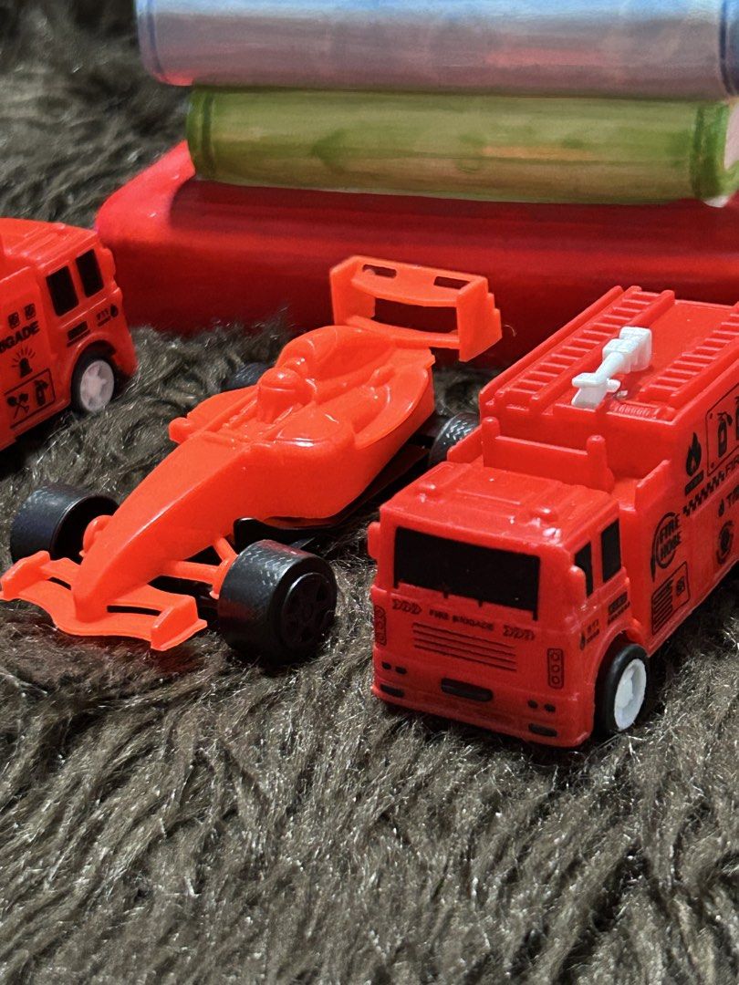 Toy Fire Brigade Cars Set (Category: Vehicle & Diecast Models) located in Angeles City. Submitted by zyeplustradings (Listing ID 1430234898, Image 2). Description: Set of three toy cars, including a tow truck, a race car, and a fire truck. The fire trucks have ladders and the tow truck has a crane. All cars are red. The cars have white wheels and black tires. The fire trucks have "Fire Brigade" printed on them..