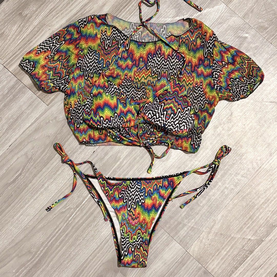 Trippy Print Bikini 3in1 Set - Size S (Category: Bikinis & Swimsuits) located in Tarlac. Submitted by shantirisque (Listing ID 1430259741, Image 2). Description: Bikini set features a vibrant, colorful trippy print. It includes a triangle top with adjustable ties and a matching bottom. The set is size small. The fabric composition is 82% polyester and 18% elastane. It is recommended to wash dark colored clothes separately..
