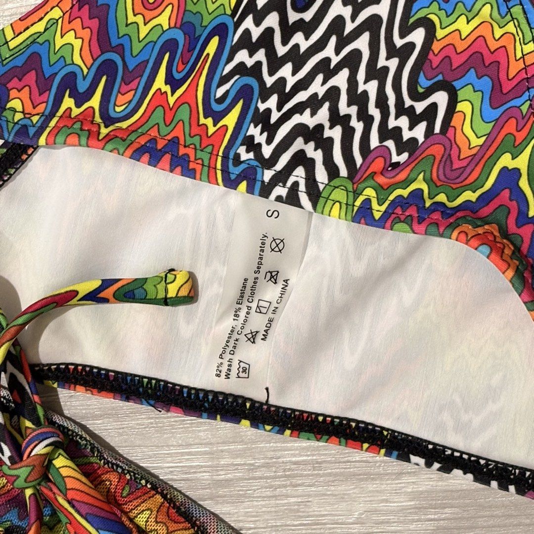 Trippy Print Bikini 3in1 Set - Size S (Category: Bikinis & Swimsuits) located in Tarlac. Submitted by shantirisque (Listing ID 1430259741, Image 3). Description: Bikini set features a vibrant, colorful trippy print. It includes a triangle top with adjustable ties and a matching bottom. The set is size small. The fabric composition is 82% polyester and 18% elastane. It is recommended to wash dark colored clothes separately..