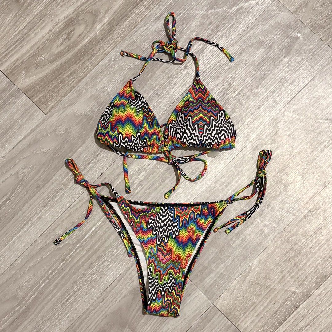 Trippy Print Bikini 3in1 Set - Size S (Category: Bikinis & Swimsuits) located in Tarlac. Submitted by shantirisque (Listing ID 1430259741, Image 1). Description: Bikini set features a vibrant, colorful trippy print. It includes a triangle top with adjustable ties and a matching bottom. The set is size small. The fabric composition is 82% polyester and 18% elastane. It is recommended to wash dark colored clothes separately..