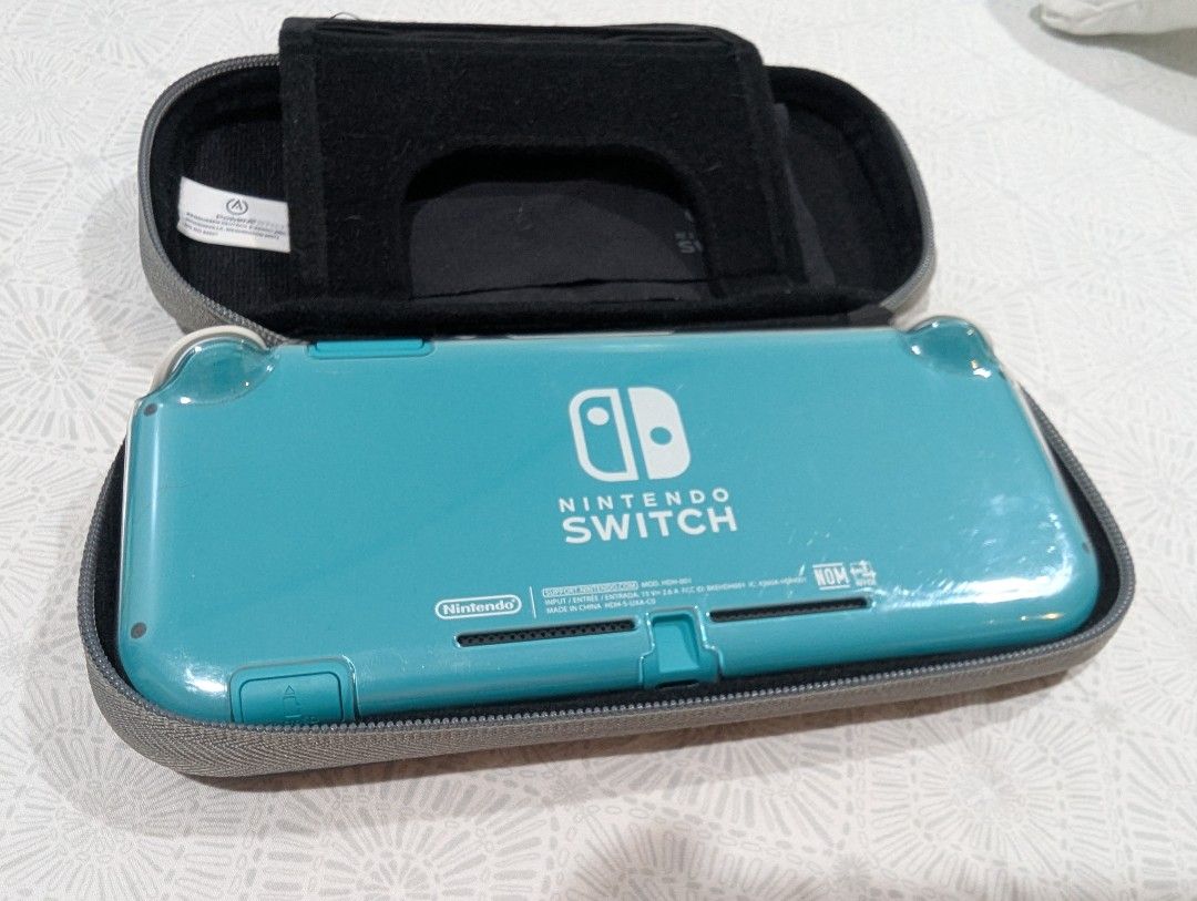 Turquoise Nintendo Switch Lite with Case - No issues! (Category: Nintendo) located in San Juan City. Submitted by renzosells_ (Listing ID 1430267239, Image 3). Description: Selling my well loved switch lite! Selling unit only with transparent case, screen protector, and Official Nintendo Switch Lite Case (with screen cleaner) Smooth use! Rush sale!!!!!! sold as is MOP: GCash Only. or Meetup cash. Buyer to cover shipping costs..