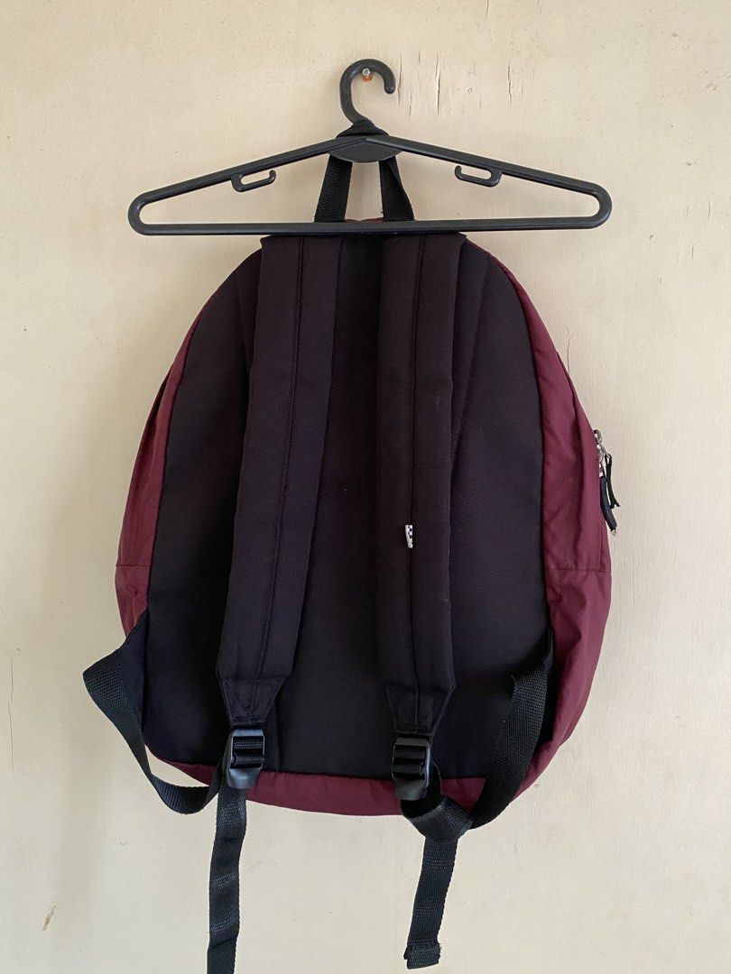 Vans Backpack - Maroon (Category: Backpacks) located in Bocaue. Submitted by pards23 (Listing ID 1430218728, Image 2). Description: Maroon Vans backpack with a front pocket and a main compartment. Features a black back panel and straps. The zippers have the Vans logo. The interior has a checkered pattern. Includes a small interior pocket. The zippers are YKK. Additional info: Color rate 8.5/10 or better need wash Condition 9/10 Issue : scratches/