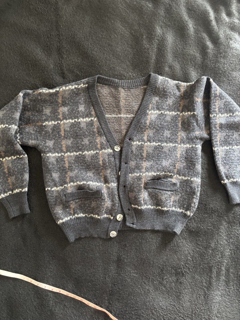 Vintage Plaid Cardigan (Category: Coats, Jackets and Outerwear) located in Quezon City. Submitted by donbuys (Listing ID 1430251795, Image 2). Description: Vintage cardigan features a classic plaid pattern in shades of gray, brown, and white. It has a V-neckline, button-down closure, and two front pockets. The sleeves have ribbed cuffs. Measurements are provided in the images..