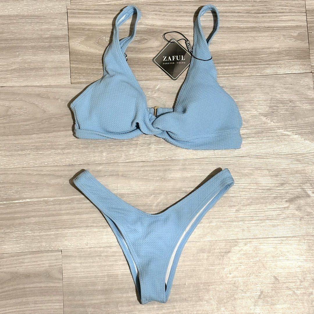 Zaful Blue knot Bikini Set (Category: Bikinis & Swimsuits) located in Tarlac. Submitted by shantirisque (Listing ID 1430264438, Image 1). Description: Zaful bikini set with pads features a light blue color and a textured fabric. The top has a twisted front detail and adjustable straps. The set includes a high-cut bottom. The size is Small (S)..