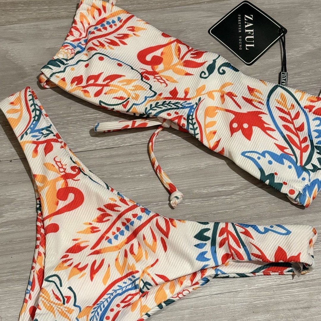 Zaful Paisley Print Bikini Set - Size S (Category: Bikinis & Swimsuits) located in Tarlac. Submitted by shantirisque (Listing ID 1430261049, Image 3). Description: Zaful bikini set with pads features a vibrant paisley print. It includes a top with adjustable straps and a tie detail, along with a matching high-cut bottom. The set is size S, as indicated on the tag. Perfect for your next beach trip!.