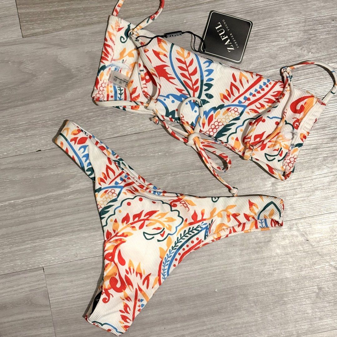 Zaful Paisley Print Bikini Set - Size S (Category: Bikinis & Swimsuits) located in Tarlac. Submitted by shantirisque (Listing ID 1430261049, Image 2). Description: Zaful bikini set with pads features a vibrant paisley print. It includes a top with adjustable straps and a tie detail, along with a matching high-cut bottom. The set is size S, as indicated on the tag. Perfect for your next beach trip!.