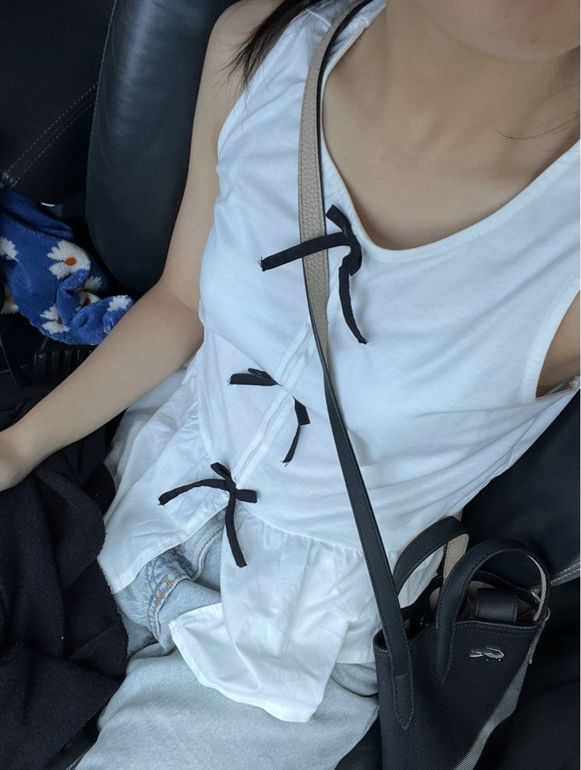 Zara White Tank Top with Bows (Category: Sleeveless) located in Paranaque City. Submitted by leyleysells (Listing ID 1430297707, Image 1). Description: ⤷ Actual pictures are listed and taken by me! ⤷ Last price posted ⤷ Bought in UK🇬🇧 MOP: Gcash MOD: Lalamove, J&T.