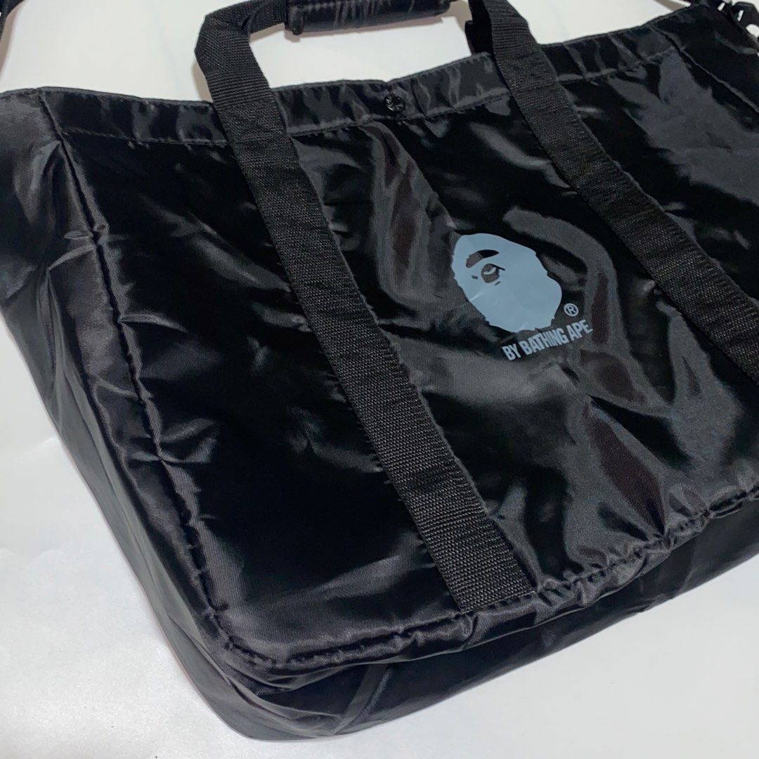 A Bathing Ape Two-Way Nylon Tote Bag (Category: Tote Bags) located in Manila. Submitted by sometimesalways (Listing ID 1430557027, Image 3). Description: A Bathing Ape Two-Way Nylon Tote Bag Large compartment, very spacious Can be used as a: Tote, Shoulder, Sling bag Issue/s: N/A Price: 1500 Shipped (for J&T Express only).
