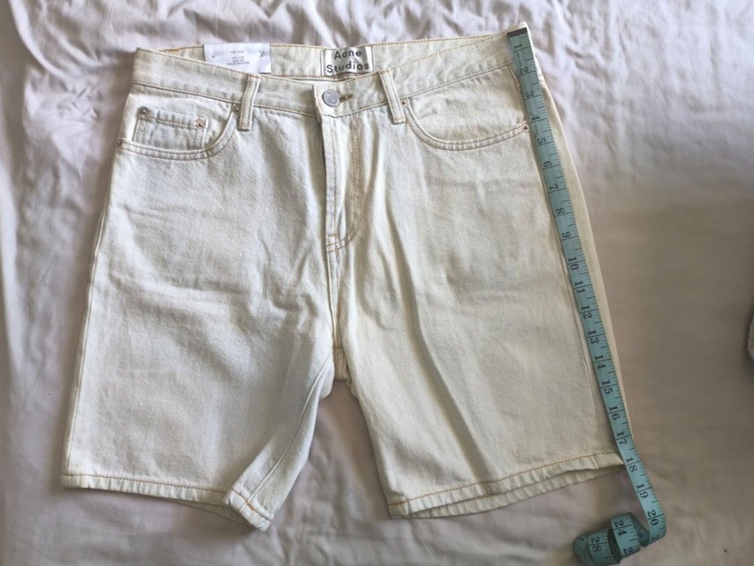 Acne Studios Denim Shorts (Category: Shorts) located in Pavia. Submitted by deusk (Listing ID 1430429276, Image 2). Description: These Acne Studios denim shorts feature a light wash and a classic five-pocket design. The shorts have a low waist and a slim leg, tapering from the knee. The size is 30/32. They are perfect for a casual, everyday look. The shorts have a button closure and belt loops. Never used..