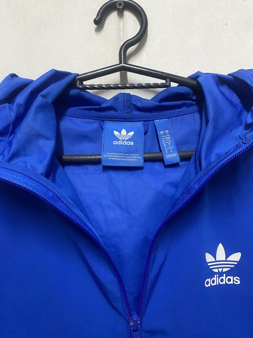 Adidas Original Blue Windbreaker Jacket (Category: Coats, Jackets and Outerwear) located in Manila. Submitted by relovedmnl (Listing ID 1430566675, Image 3). Description: *** READING SAVES TIME *** FOR SALE: Adidas Windbreaker with Hoodie Adidas Originals blue windbreaker jacket Fits S to M comfy and will keep you warm! NO REPAIR!!! #WindBreaker #Adidas #TechWear#SweatWear #AdidasBlue *** PLEASE NOTE THAT THIS ITEM IS AVAILABLE UNLESS MARKED AS S