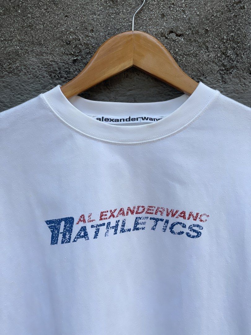 Alexander Wang Athletics White T-shirt (Category: Luxury Apparel) located in Makati City. Submitted by christian_g (Listing ID 1430574209, Image 2). Description: Alexander Wang R Athletics •Size: XL (30L 24W) •Excellent condition •No issue.