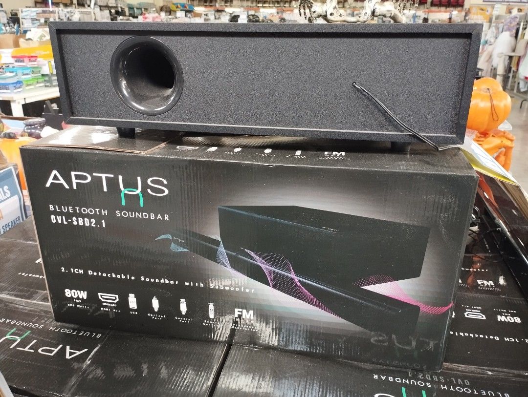 Aptus 2.1CH Bluetooth Soundbar with Subwoofer (Category: Soundbars, Speakers & Amplifiers) located in Caloocan City. Submitted by dhiony (Listing ID 1430428956, Image 1). Description: Aptus 2.1CH Bluetooth soundbar with subwoofer. Features 80W power output. Includes FM radio. The box shows the model number SVL-SB02.1. The soundbar is black. The price tag shows ₱4,999.00..