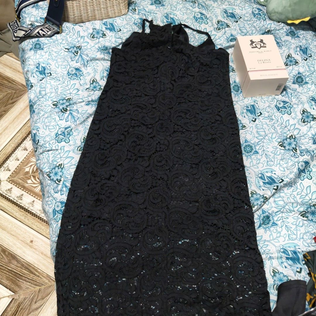 Bayo Black Lace Dress (Category: Dresses) located in Manila. Submitted by stuff_finder (Listing ID 1430527335, Image 1). Description: Elegant black lace dress from Bayo. Features a sleeveless design with spaghetti straps. The dress has a midi length. Perfect for special occasions or a night out. The dress is made of a delicate lace fabric..