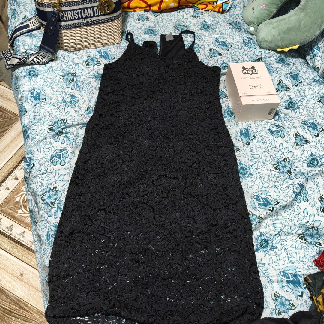 Bayo Black Lace Dress (Category: Dresses) located in Manila. Submitted by stuff_finder (Listing ID 1430527335, Image 3). Description: Elegant black lace dress from Bayo. Features a sleeveless design with spaghetti straps. The dress has a midi length. Perfect for special occasions or a night out. The dress is made of a delicate lace fabric..