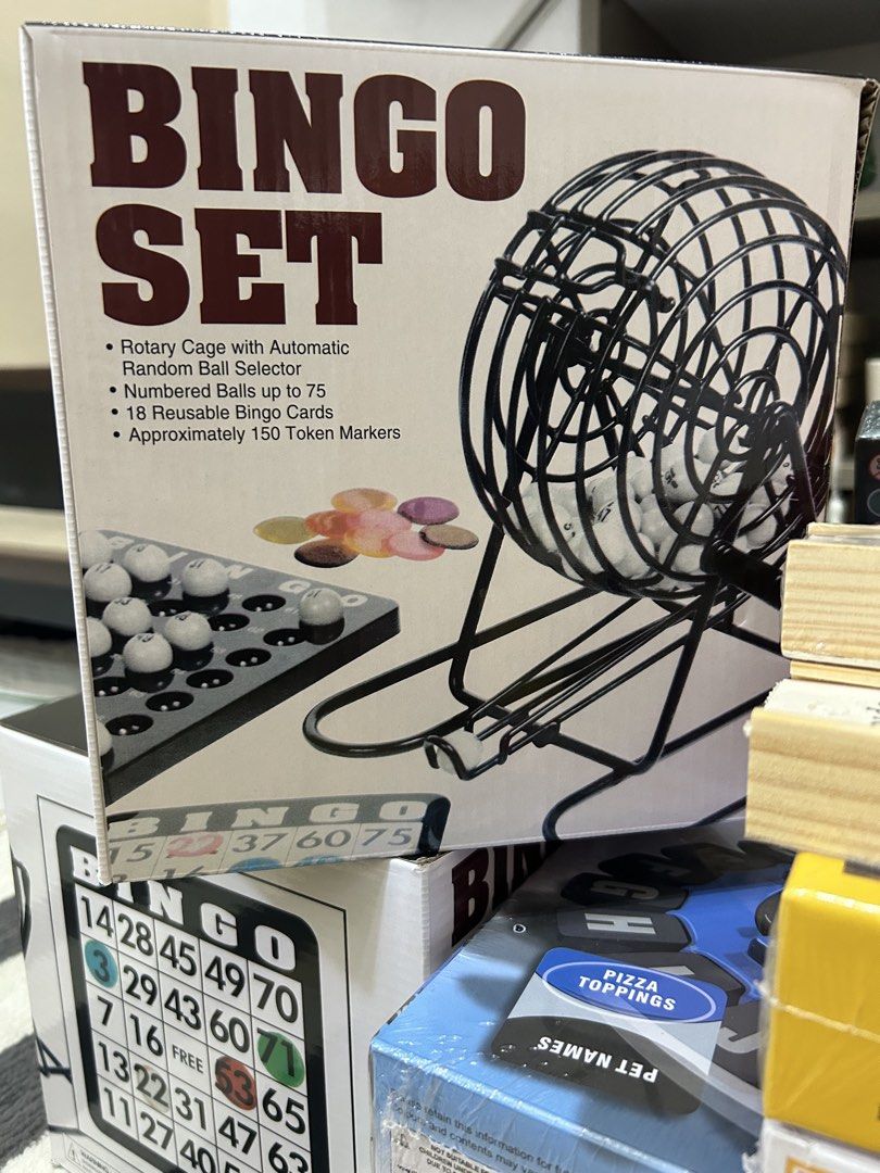 Bingo Set with Rotary Cage (Category: Board Games & Puzzles) located in Quezon City. Submitted by playboxph (Listing ID 1430464427, Image 1). Description: Bingo Set includes a rotary cage with an automatic random ball selector. It comes with numbered balls up to 75, 18 reusable bingo cards, and approximately 150 token markers. Perfect for game nights with family and friends. Get ready for hours of fun!.
