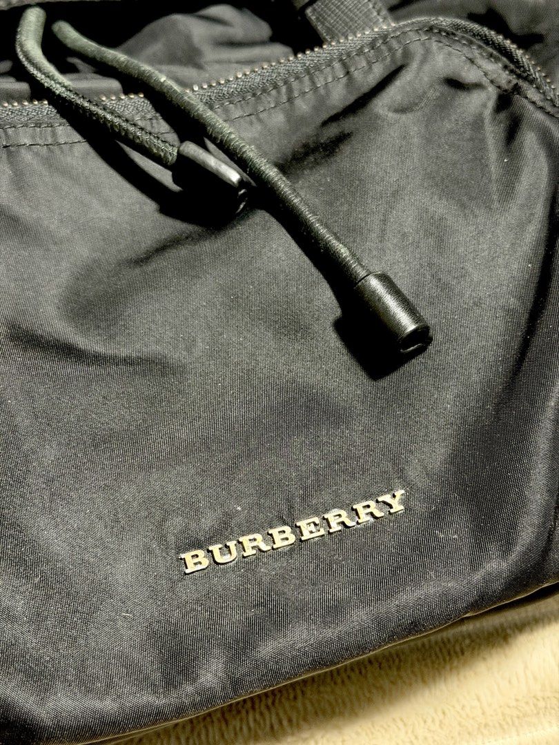 Burberry Black Backpack (Category: Backpacks) located in Quezon City. Submitted by pt_rk (Listing ID 1430463946, Image 2). Description: Length- 14” Width - 6” Height- 18” BURBERRY Black Technical Nylon Large Rucksack Backpack Bag.