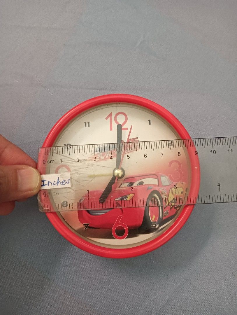 Cars Lightning McQueen Alarm Clock (Category: Clocks) located in Mandaluyong City. Submitted by ehrgeee (Listing ID 1430480627, Image 2). Description: Lightning McQueen display alarm clock. No scratches on the glass circle part. This clock is for display only because it is not working. No other issues except for minor dot scratches to the right of the red paint. Please refer to the last photo for reference. .