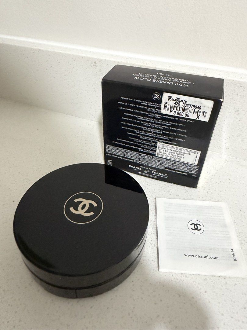 Chanel Vitalumiere Glow Foundation SPF 15 (Category: Makeup) located in Cainta. Submitted by mycosy.life (Listing ID 1430516639, Image 2). Description: Luxury makeup! Hard to find! Chanel Vitalumiere Glow foundation in 20 Beige. This foundation provides luminous touch hydration and comfort. The box includes the foundation compact, the original box, and an information leaflet. The price tag from Rustan's is still attached, showing the original pri