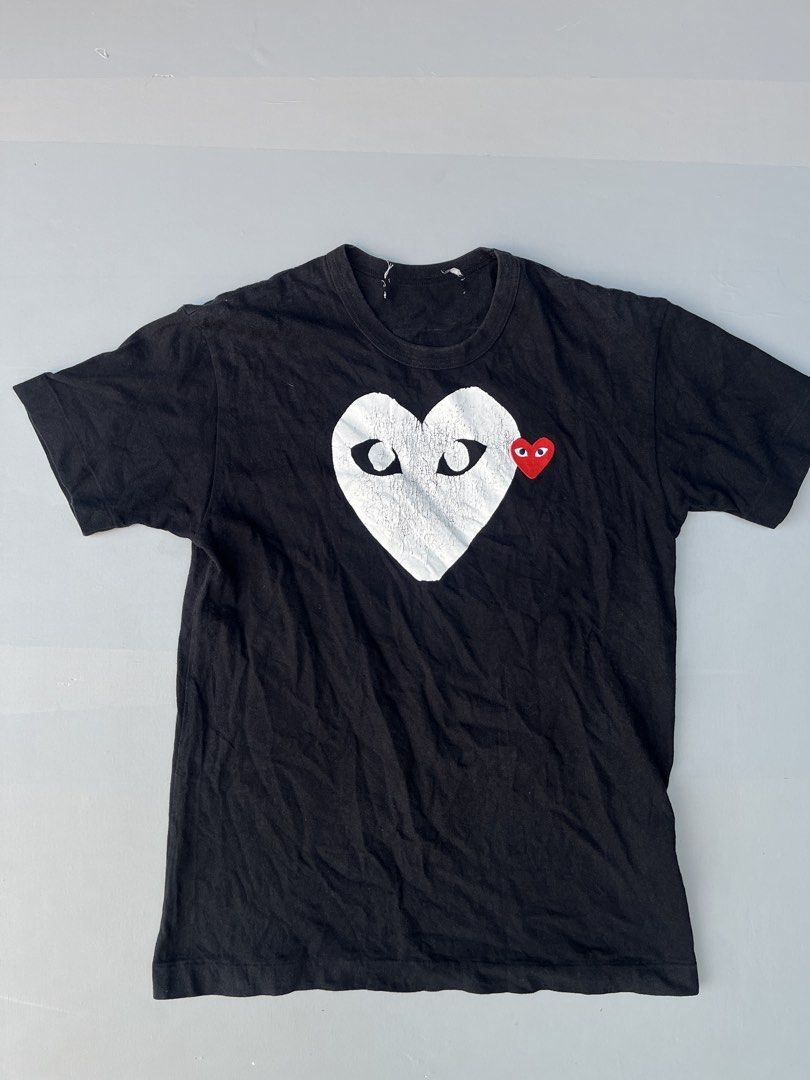 Comme des Garcons Play Heart Logo Tee (Category: Shirts) located in Mabalacat. Submitted by aas_thriftfings (Listing ID 1430506322, Image 1). Description: - Comme des Garcons Play Heart Logo Tee - Size: S - Color: Black - Features the iconic heart logo.