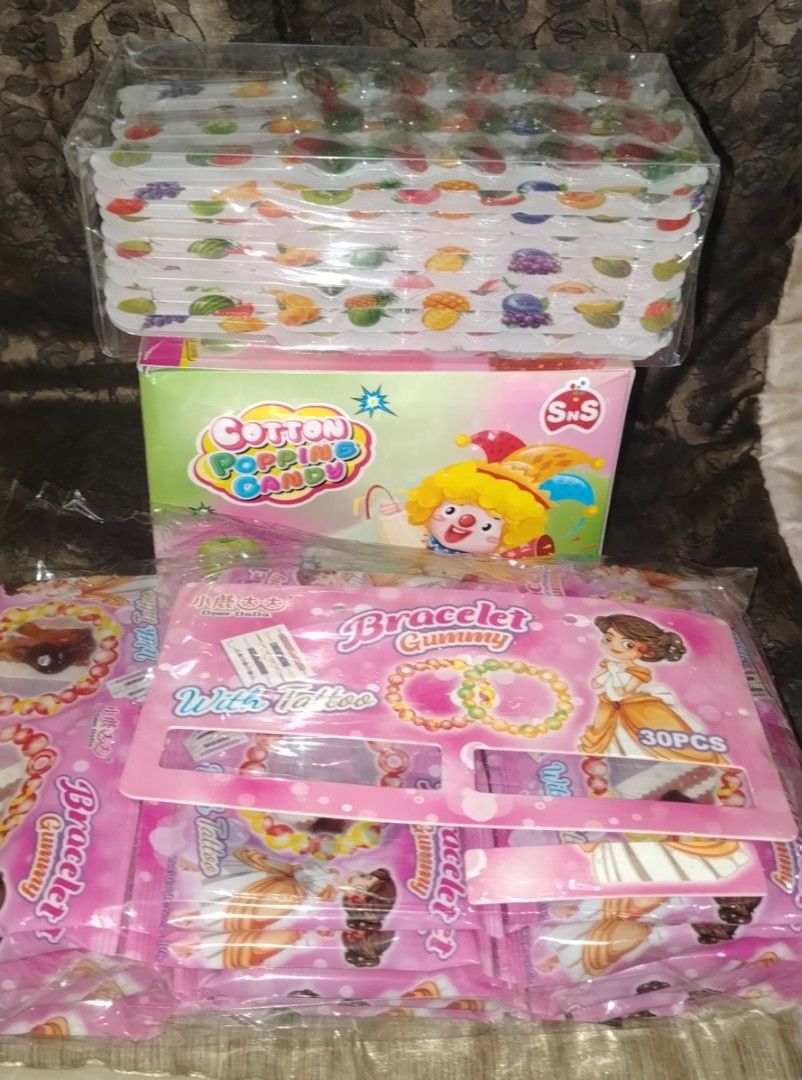 Cotton Popping Candy, Bracelet, and Fruit-Shaped Candy (Category: Bracelets) located in Quezon City. Submitted by moonchayo (Listing ID 1430589633, Image 1). Description: Sold per set 3 packs per set.