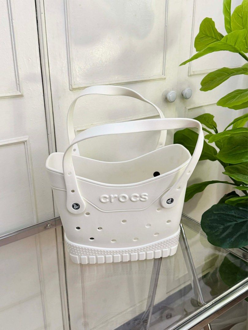 Crocs Bag (Category: Luxury Bags & Wallets) located in Batangas. Submitted by YSABELLE_MARGARETTE (Listing ID 1430423294, Image 3). Description: the perfect beach bag!!! ☀️ crocs classic tote 💘 colors: hot pink, powder pink, taupe, black, white size small 11 x 7.5 inches with free jibbitz, ecobag .
