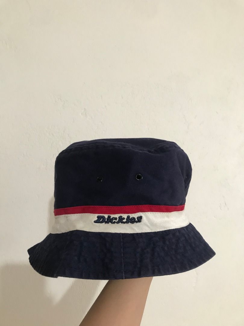 Dickies Bucket Hat in Navy Blue (Category: Hats & Beanies) located in Baguio. Submitted by circesisle (Listing ID 1430511098, Image 1). Description: Brand: Dickies Condition: GUC Size: S-M (medium on tag but fits small) Measurements (Flat) - Head Diameter: 7.5 inches Description: Navy blue bucket hat from Dickies. Features a white and red stripe around the hat with the Dickies logo embroidered on the front. The hat has a classic bucket hat shape 