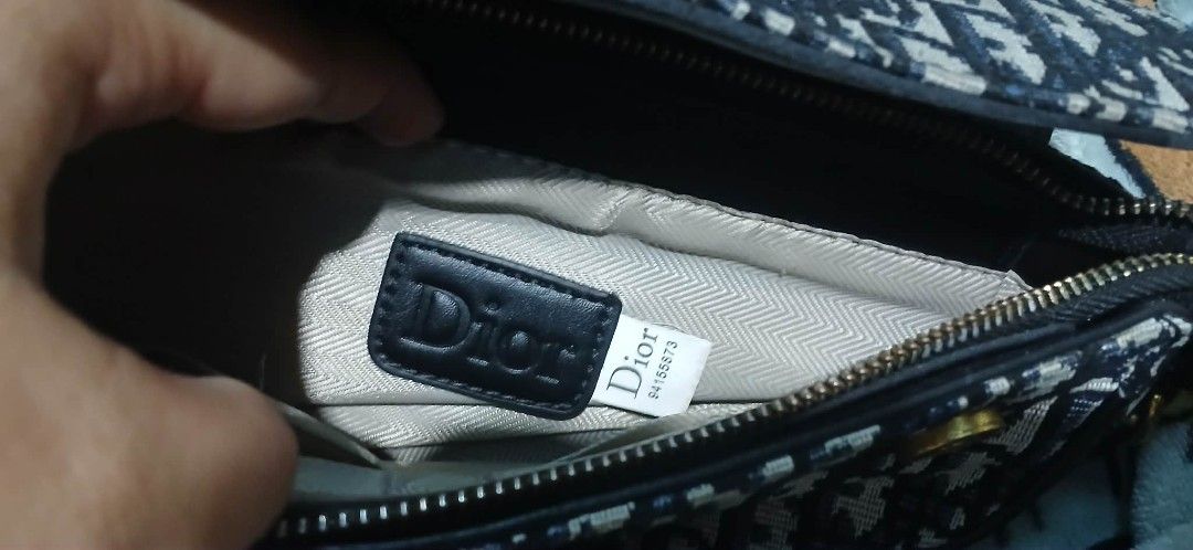 Dior Saddle Bag (Category: Luxury Bags & Wallets) located in Cavite. Submitted by crispeleno90843 (Listing ID 1430407320, Image 2). Description: Dior Saddle Bag. Features the iconic Dior Oblique canvas. Includes a black leather strap and gold-tone hardware. The interior has a Dior label. A classic and stylish accessory..