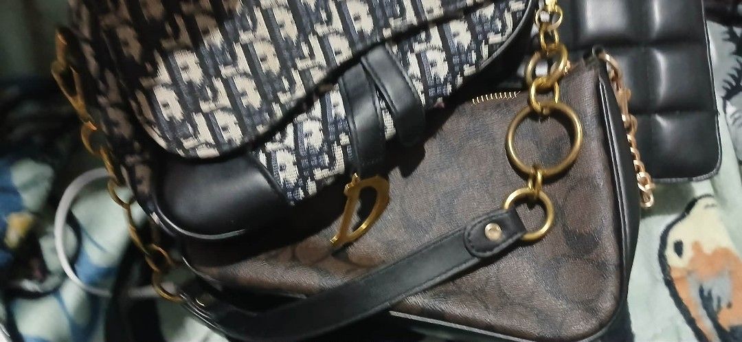 Dior Saddle Bag (Category: Luxury Bags & Wallets) located in Cavite. Submitted by crispeleno90843 (Listing ID 1430407320, Image 3). Description: Dior Saddle Bag. Features the iconic Dior Oblique canvas. Includes a black leather strap and gold-tone hardware. The interior has a Dior label. A classic and stylish accessory..