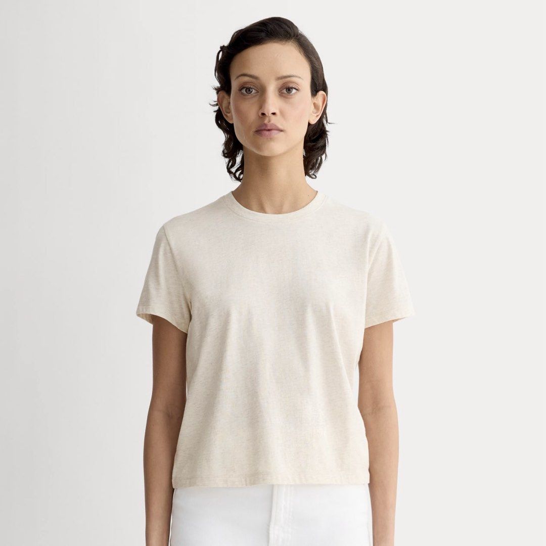 Everlane Crew Neck T-shirt S (Category: Shirts) located in Calamba. Submitted by naturesfield (Listing ID 1430404055, Image 1). Description: Everlane crew neck box cut t-shirt is a classic wardrobe staple. It features a round neckline and short sleeves. The shirt is a light beige color. The size is Small. Made from a soft, comfortable fabric, it's perfect for everyday wear. The Everlane logo is visible on the neckline. Bought for 2500. Slightly n
