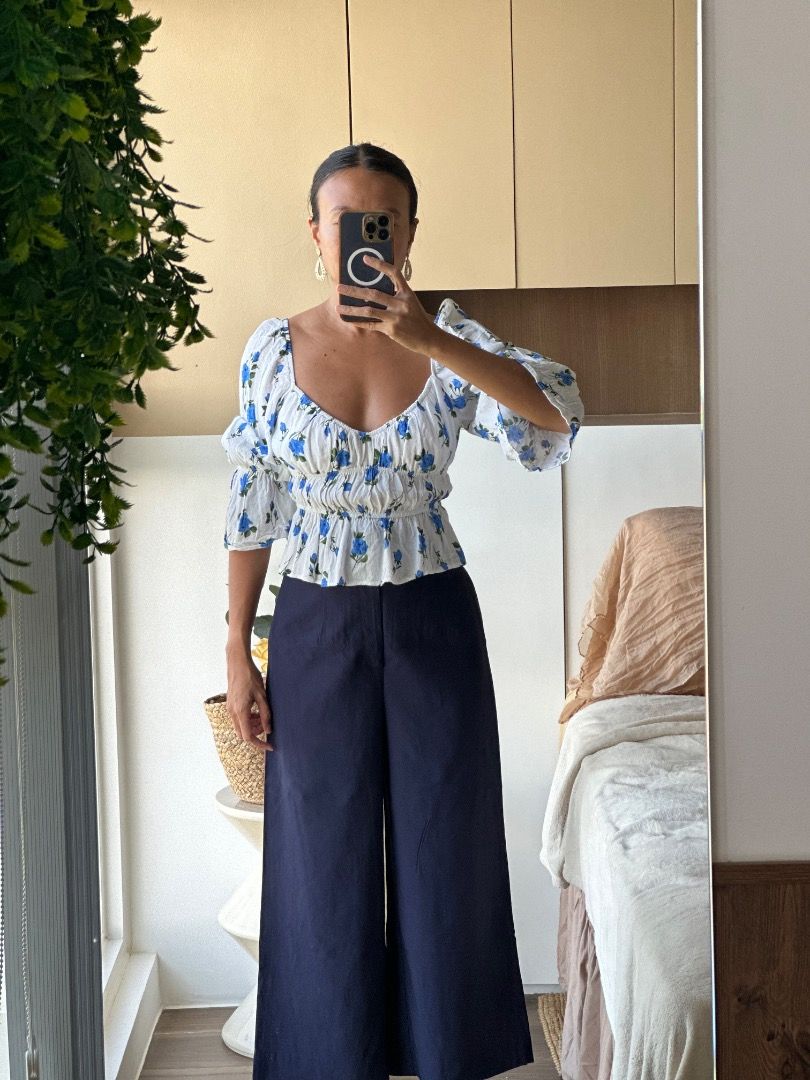 Bershka Off-Shoulder Top (Category: Blouses) located in Malay. Submitted by joycking (Listing ID 1430554445, Image 2). Description: (Top only) White off-shoulder top with blue floral print. RFS: Decluttering ✨ barely used, still in great condition.