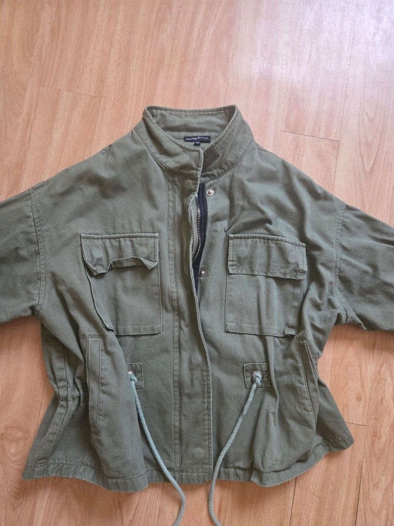 Green Embroidered Jacket (Category: Coats, Jackets and Outerwear) located in Imus. Submitted by tinph (Listing ID 1430429675, Image 2). Description: Stylish green jacket with multiple pockets and a zipper closure. Features an embroidered floral design on the back. Includes drawstrings for an adjustable fit. The jacket has long sleeves and a collared neckline. Perfect for adding a unique touch to your outfit. fits XS to M MOP: BDO/BPI/Gcash Shippi