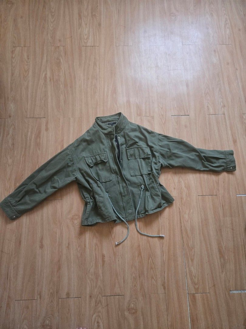 Green Embroidered Jacket (Category: Coats, Jackets and Outerwear) located in Imus. Submitted by tinph (Listing ID 1430429675, Image 1). Description: Stylish green jacket with multiple pockets and a zipper closure. Features an embroidered floral design on the back. Includes drawstrings for an adjustable fit. The jacket has long sleeves and a collared neckline. Perfect for adding a unique touch to your outfit. fits XS to M MOP: BDO/BPI/Gcash Shippi