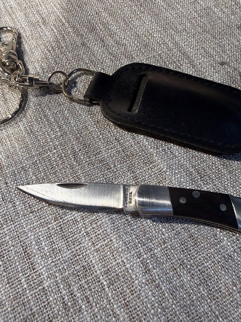 Japan Pocket Knife with Leather Case (Category: Knives & Chopping Boards) located in Valenzuela. Submitted by missp22 (Listing ID 1430567240, Image 3). Description: Pocket knife comes with a black leather case and a keychain. The knife has a silver blade and a dark wooden handle. -Very sharp.