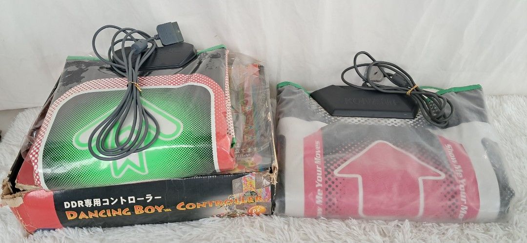 Japan 2pcs Joytech DDR Dancing Boy Controller for PS1 (Category: Controllers) located in Bulacan. Submitted by amarijapansurplus (Listing ID 1430443591, Image 1). Description: Bundle Sale‼️❗️‼️ w 750 each take all for 1400 - Dancing Boy & Dance Dance Revolution dance pads. - Compatible with PlayStation. - Includes two dance pads. - Original packaging included (boxes show wear). - Features unique designs. - Ready to use. *Untested *good condition 