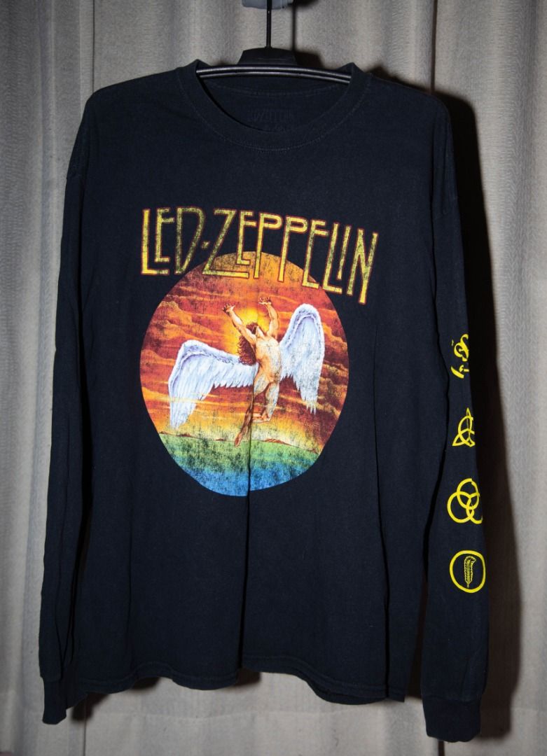 Led Zeppelin Long Sleeve Shirt (Category: Tshirts & Polo Shirts ) located in Bulacan. Submitted by mugeeeeen (Listing ID 1430475517, Image 1). Description: Black long sleeve shirt featuring the Led Zeppelin logo and the iconic Icarus image on the front. The right sleeve has several symbols in yellow. This shirt is perfect for any Led Zeppelin fan..