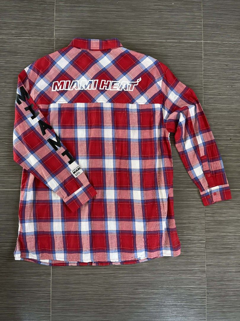 Miami Heat Plaid Shirt (Category: Tshirts & Polo Shirts ) located in Guagua. Submitted by sarms_03 (Listing ID 1430440644, Image 3). Description: Miami Heat plaid shirt with long sleeves. Features the Miami Heat logo on the chest and "MIAMI" printed on the left sleeve. The back of the shirt has "MIAMI HEAT" printed across the shoulders. Made in Vietnam. Size L..