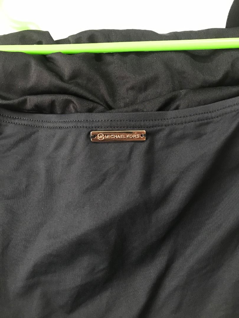 Michael Kors Black Halter Swimsuit Large (Category: Bikinis & Swimsuits) located in Baguio. Submitted by circesisle (Listing ID 1430499575, Image 2). Description: Brand: Micheal Kors Condition: Good as new Size: Large (Size 14 UK) Measurements (Flat) - Chest: 15.5 inches - Waist: 13.5 inches - Hips: 18 inches Black Michael Kors swimsuit with halter neck. Features a gold-tone detail at the neckline. Size 14. Stretchable. Has bra padding slots. Gre