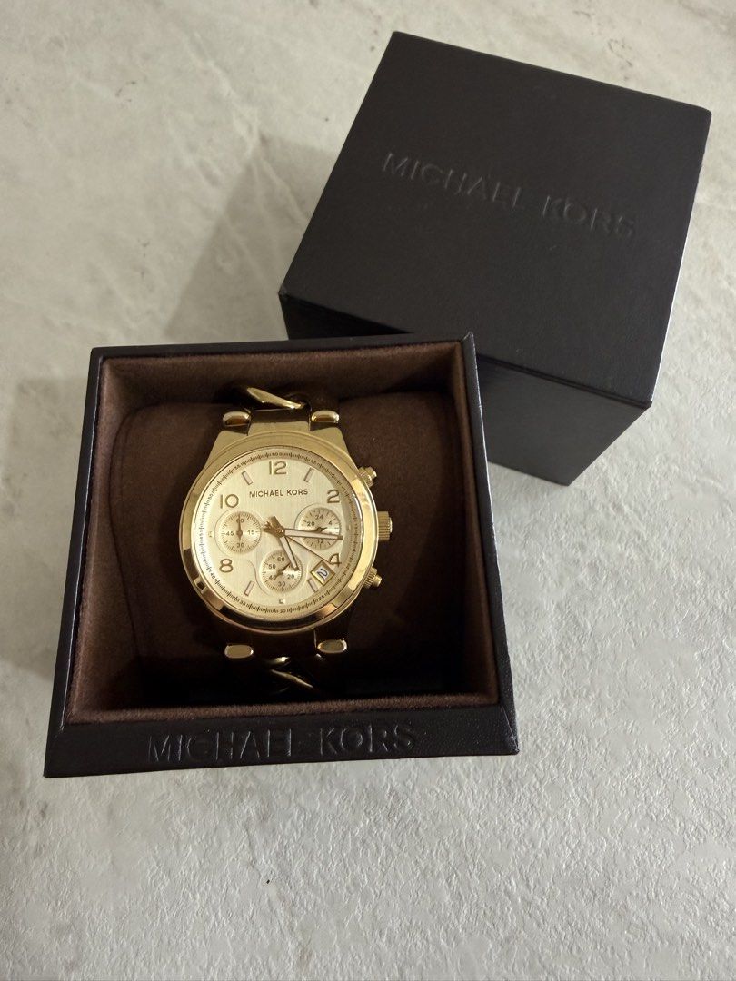 Michael Kors Gold Chain Watch (Category: Women's Watches) located in Quezon City. Submitted by cbake (Listing ID 1430445047, Image 3). Description: - Michael Kors gold-toned watch - Chain-link bracelet - Round face with sub-dials - Date display - Gold dial and bracelet - Includes original box - Comes with instruction card and tag.