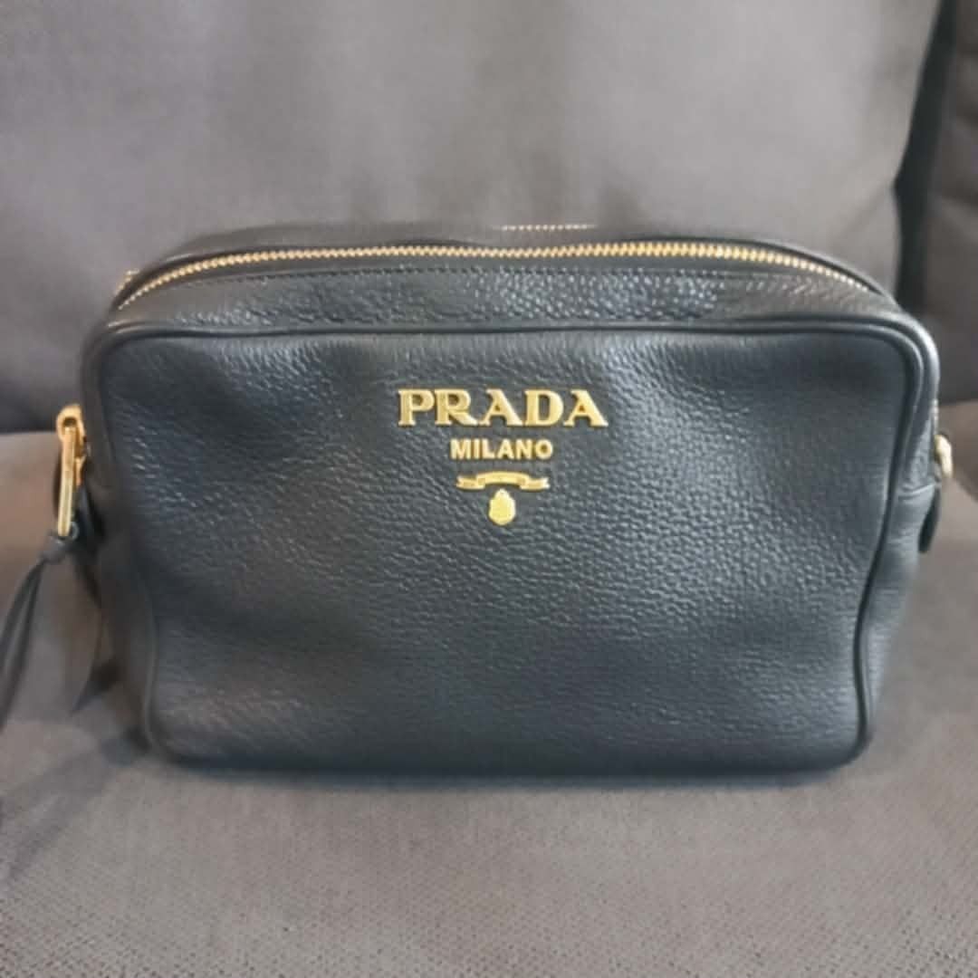 Prada Milano Black Leather Bag (Category: Luxury Bags & Wallets) located in Caloocan City. Submitted by Sacha88 (Listing ID 1430515749, Image 1). Description: Prada Vitello Phenix Double Zip Crossbody Camera Bag in black. ​It is a popular "everyday" luxury bag known for its functional design and durable materials. Here are the specific details regarding this model: ​Key Specifications ​Material: Crafted from Vitello Phenix leather, which is a thi