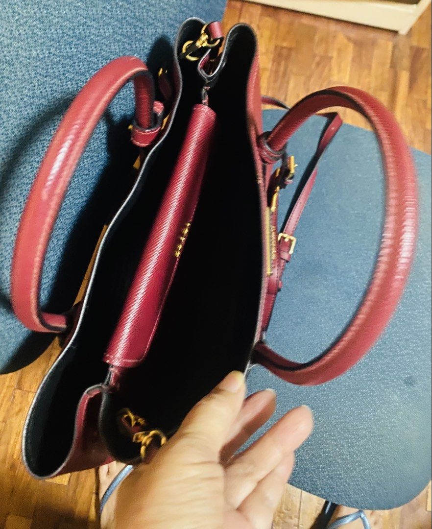 Authentic Prada saffiano cuir leather double tote bag (Category: Luxury Bags & Wallets) located in Manila. Submitted by lodmallare85627 (Listing ID 1392792725, Image 3). Description: Seldom used though strap is no longer original but saffiano leather pa din which i bought frim a supplier. I lost the original strap kasi. Burgundy color super nice Lowered the price already fixed price authentic….very roomy can put a lot of things👌price is cheaper 