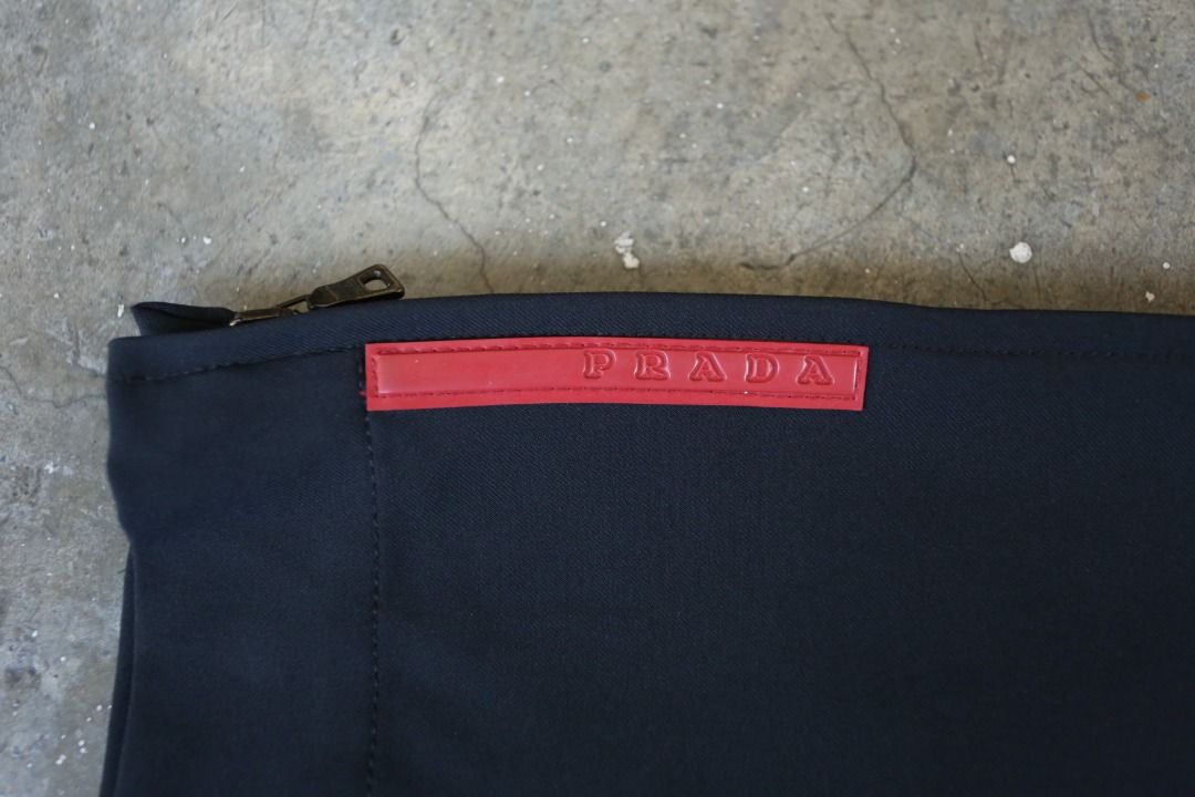 Prada Sport - Technical Trousers (Category: Trousers) located in Manila. Submitted by graymatter_ (Listing ID 1430513119, Image 3). Description: Prada Sport - Technical Trousers circa 2000s Tagged Size: 46 Condition: 9.5/10 Material: 89% Nylon, 11% Elastane Zipper: Opti Made in: Italy Dimensions Waist: 32 Inseam: 33 Crotch: 12.5 Thigh: 11 Leg Opening: 8.75 .