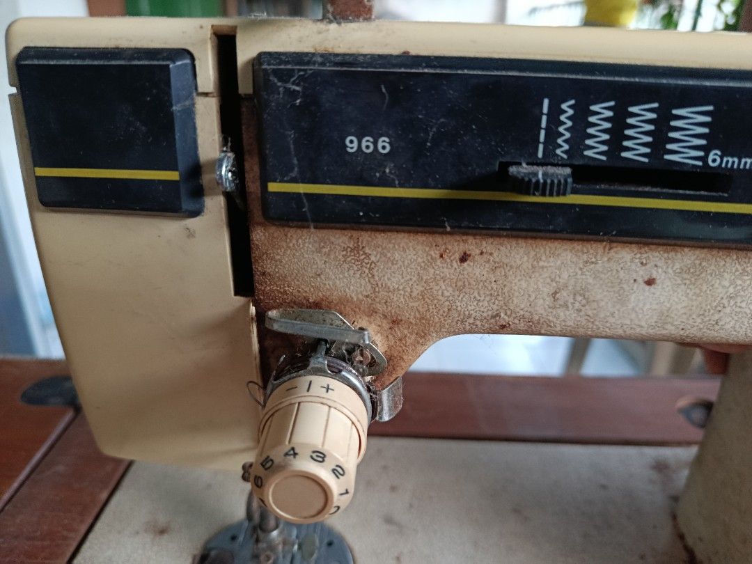 Singer Fantasia Automatic Sewing Machine (Category: Other Home Appliances) located in Quezon City. Submitted by bernadette_puyos16 (Listing ID 1430479697, Image 2). Description: Vintage Singer Fantasia Automatic sewing machine. Features a wooden table with drawers and a foot pedal. The machine has various stitch settings and a reverse function. The model number is 966. Includes the original Singer foot pedal..