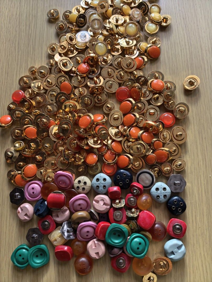 Take All 200 Assorted Buttons - Various Colors and Styles (Category: Craft Supplies & Tools) located in Rizal. Submitted by gkstcenit (Listing ID 1430401971, Image 2). Description: Large assortment of buttons in various colors, shapes, and sizes. Includes gold-toned buttons with clear and colored centers, as well as colorful plastic buttons in red, green, pink, blue, and more. Perfect for sewing, crafts, or adding a unique touch to your projects.