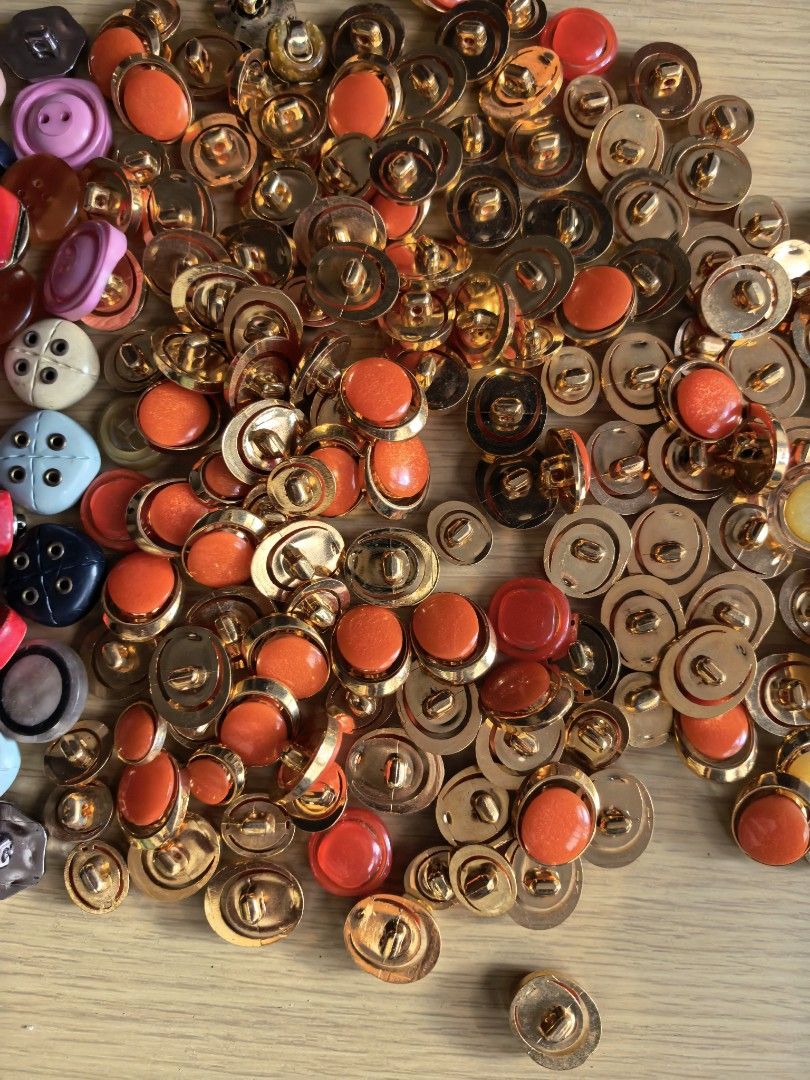 Take All 200 Assorted Buttons - Various Colors and Styles (Category: Craft Supplies & Tools) located in Rizal. Submitted by gkstcenit (Listing ID 1430401971, Image 3). Description: Large assortment of buttons in various colors, shapes, and sizes. Includes gold-toned buttons with clear and colored centers, as well as colorful plastic buttons in red, green, pink, blue, and more. Perfect for sewing, crafts, or adding a unique touch to your projects.
