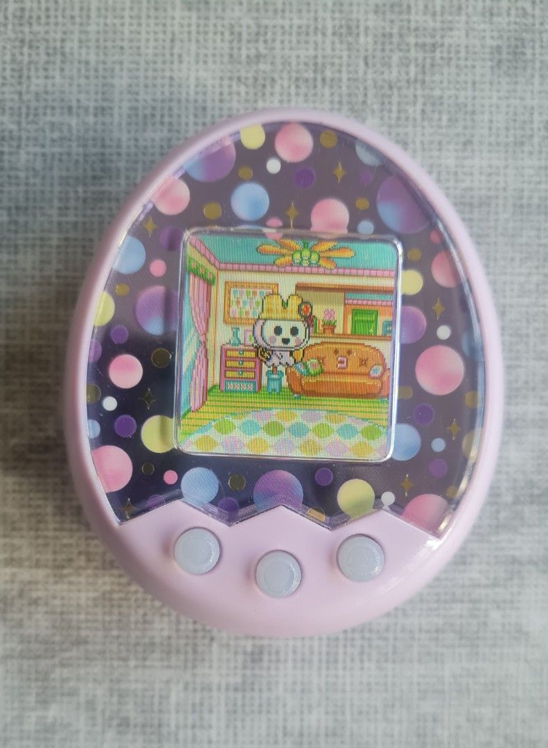Tamagotchi Mix (M!x) Melody Land Virtual Pet Toy Bandai Namco (Category: Interactive Toys) located in Singapore. Submitted by rynexxa (Listing ID 1430499087, Image 1). Description: Buttons, display and sound all working perfectly. Light scratches on unit but no cracks Screen protector on is a bit bubbly as shown and does not affect visual. All lands unlocked. Your choice to reset or continue. 99999 Gotchi pts. Cross bred with Anniversary Gift M!x