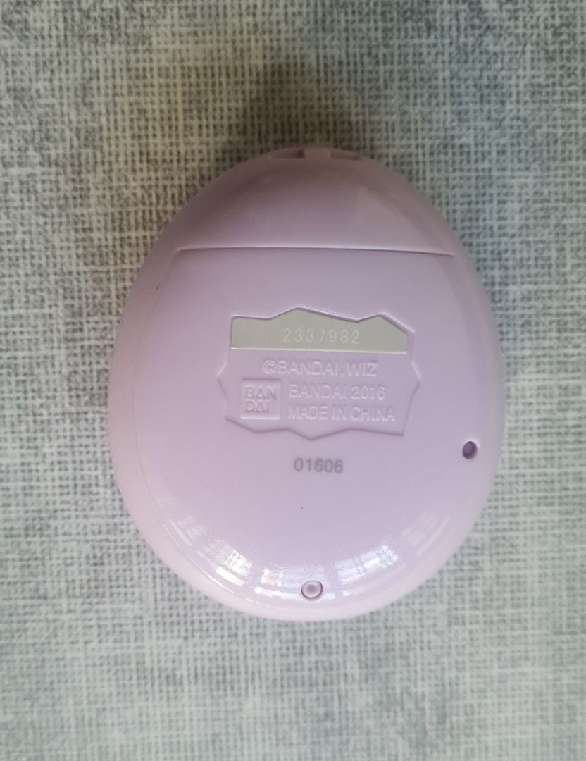 Tamagotchi Mix (M!x) Melody Land Virtual Pet Toy Bandai Namco (Category: Interactive Toys) located in Singapore. Submitted by rynexxa (Listing ID 1430499087, Image 2). Description: Buttons, display and sound all working perfectly. Light scratches on unit but no cracks Screen protector on is a bit bubbly as shown and does not affect visual. All lands unlocked. Your choice to reset or continue. 99999 Gotchi pts. Cross bred with Anniversary Gift M!x